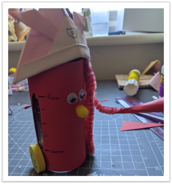 Robot fire extinguisher made from a spice jar, cardboard, pipe-cleaner and googly eyes