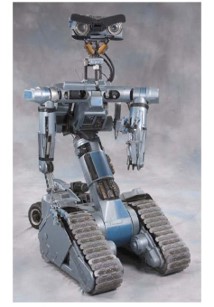A military robot that runs on tracks with multiple weaponry systems. It has a head made up of two circular camera eyes, a light strip for the mouth and flaps that act as eyebrows to give various expressions