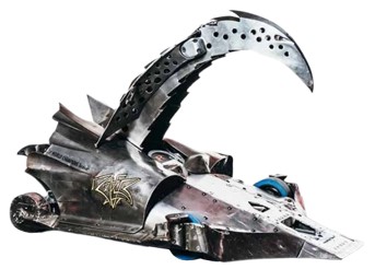A robot with a large metallic claw/beak. It has a very low ground clearance, a ramp into the pincher's range and four small blue wheels.
