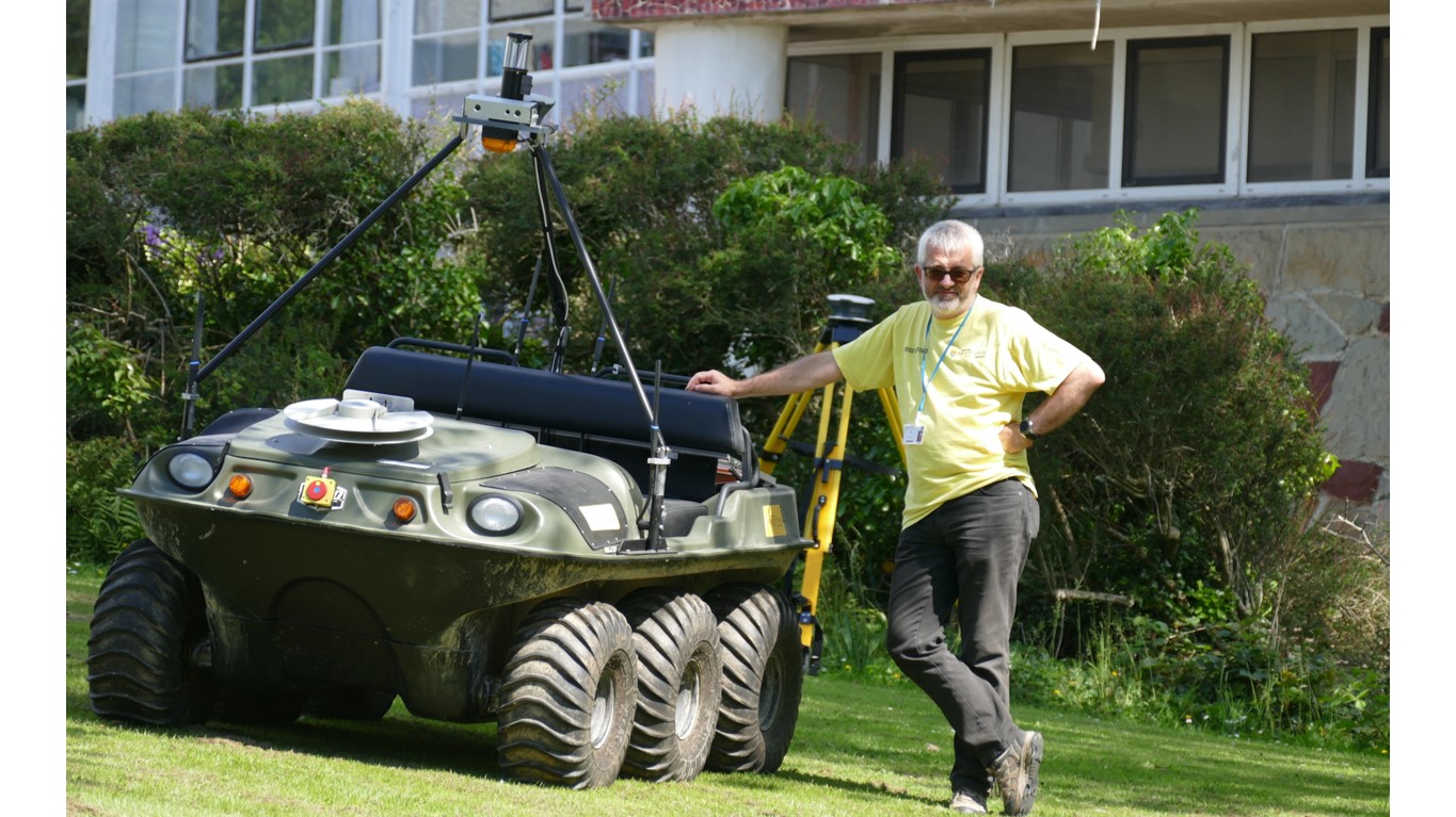 Dr Fred Labrosse with an autonomous all terrain vehicle.
