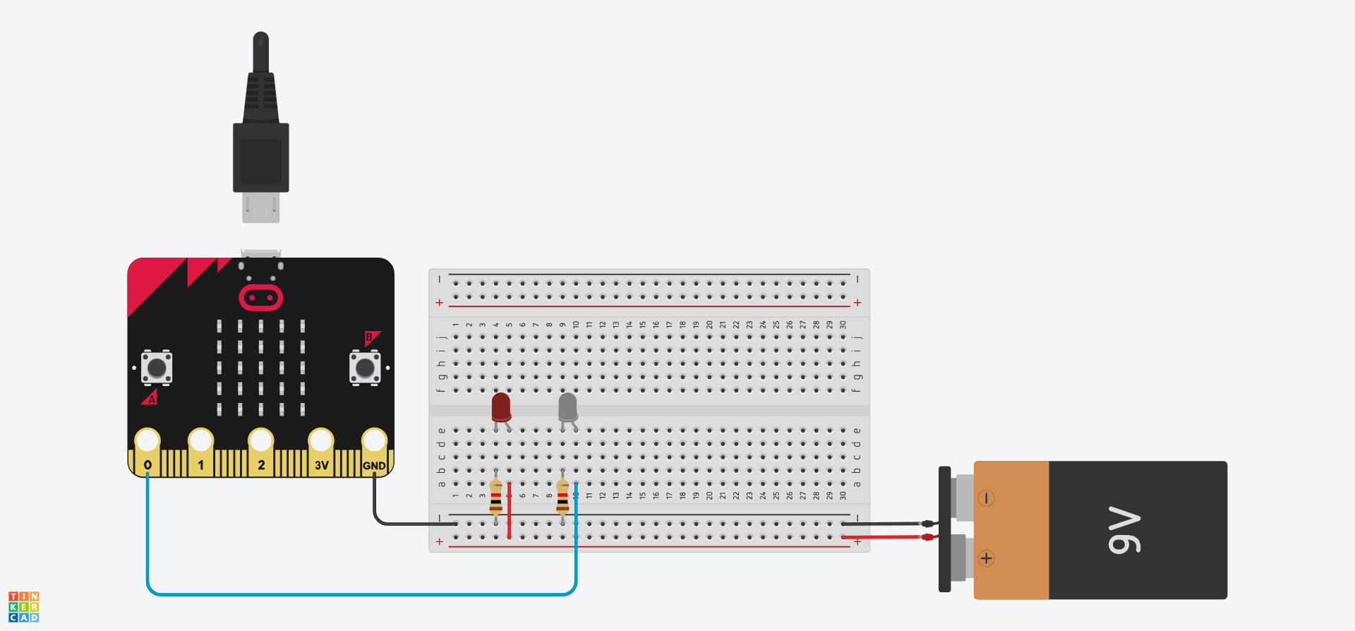 Tinkercad circuit showing the wire connecting the Micro:Bit's 3V pin to the breadboard has been removed. A 9V battery has been added, with the terminals both connected to the matching rail of the breadboard.