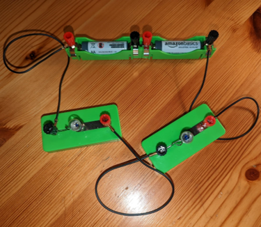 A circuit containing two AA batteries and two lightbulbs in series. None of the lights are lit.