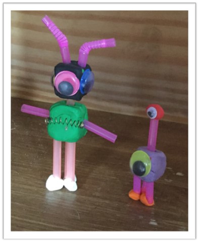 Alien-like plasticine and drinking straw robots with googly eyes