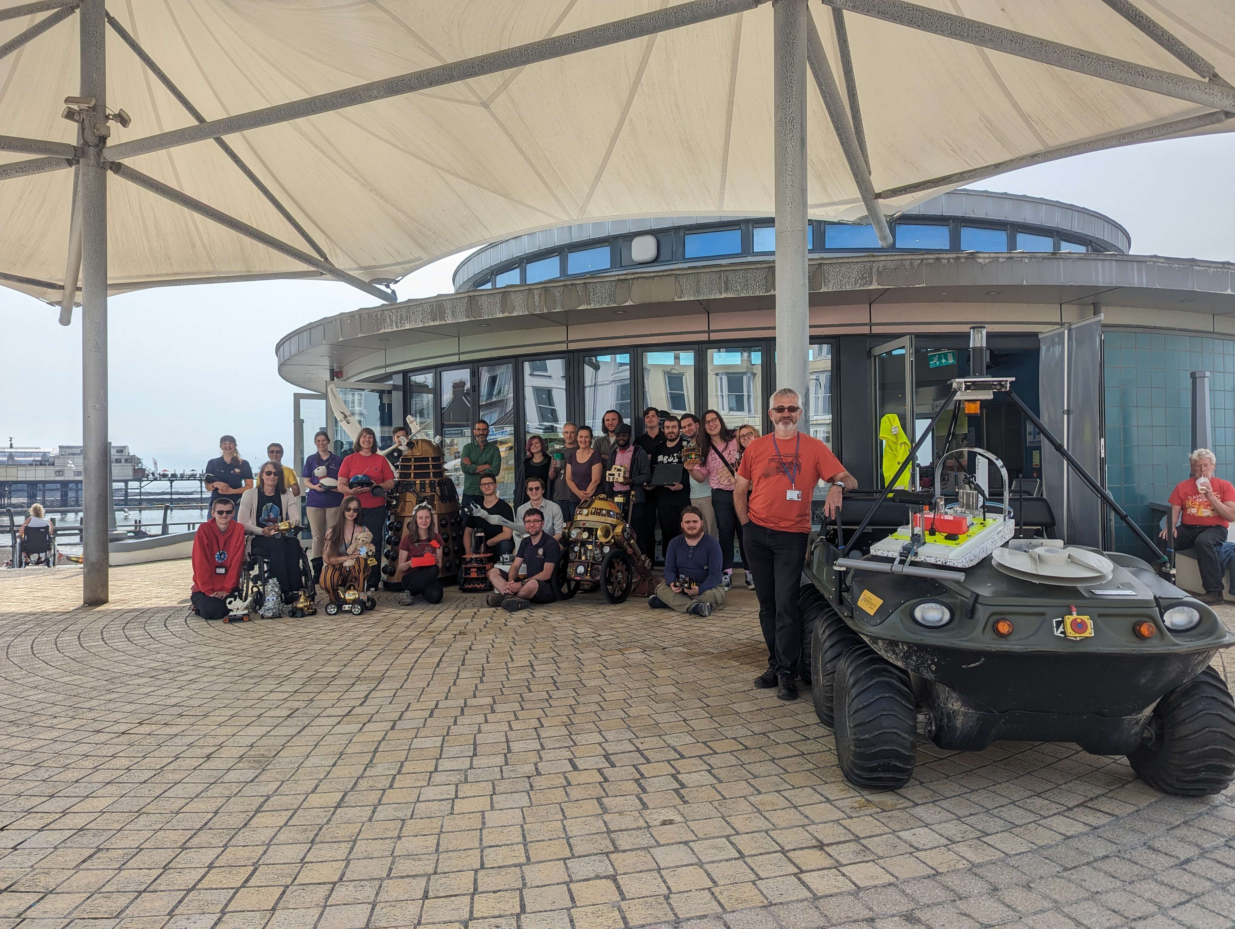 A photograph of all those involved in BeachLab 2023 outside Aberystwyth Bandstand.