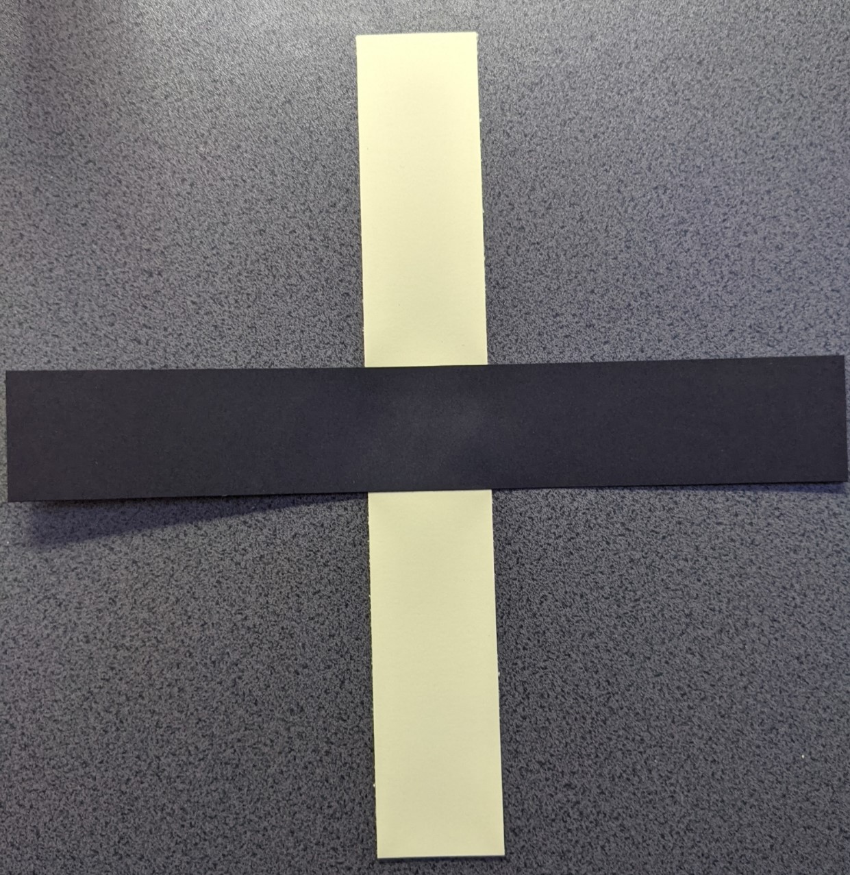 Two strips of card glued in their centres to form a cross