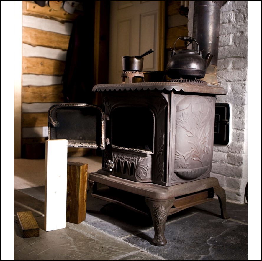 a stove with a kettle on
