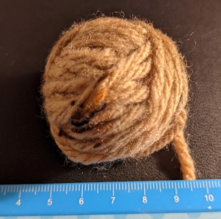 A small ball of wool retrieved from a larger one.